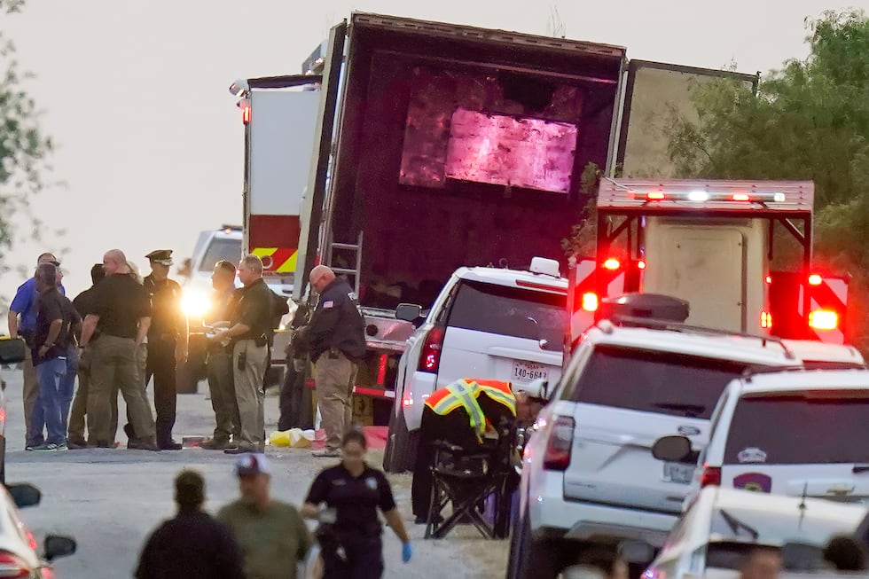 Police and other first responders work the scene where officials say dozens of people have...