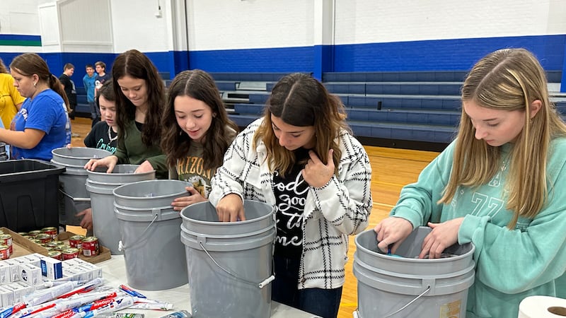 Summit Christian Academy students pack buckets to help flood victims